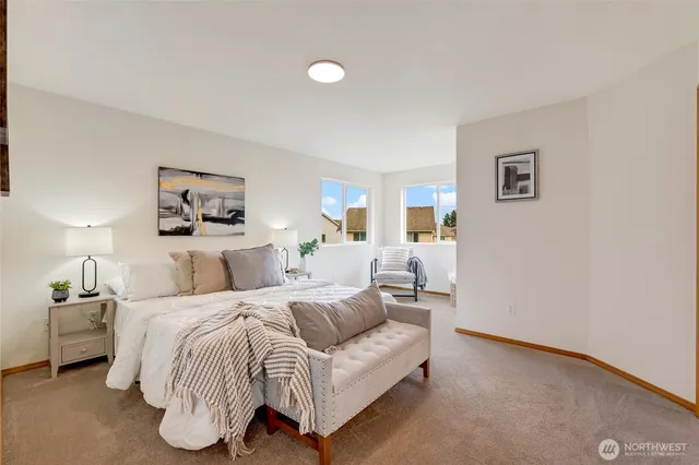 a bedroom with a bed and a night lamp