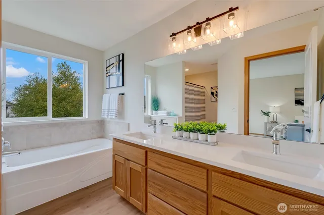 a bathroom with a sink and a large mirror