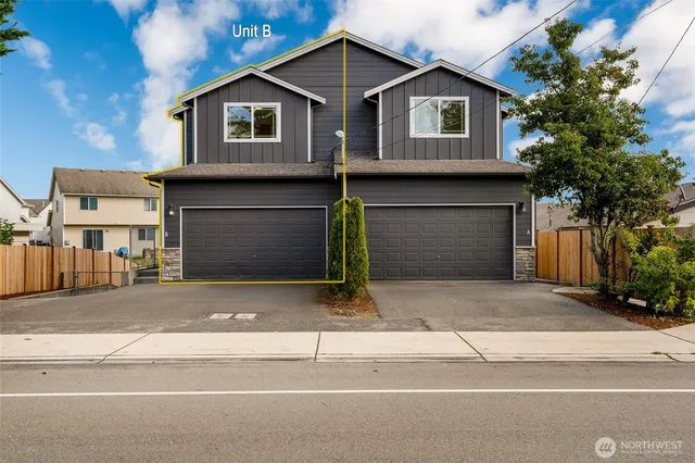 a front view of a house with garage