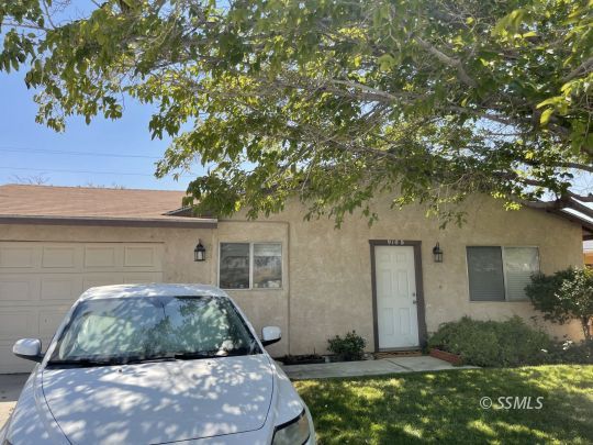 910 East Church Avenue Ridgecrest, CA 93555 - Photo 2 of 20 a front view of a house with a yard