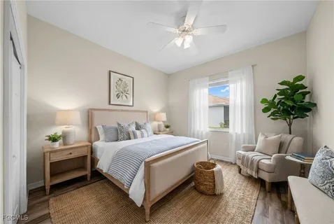 a bedroom with a bed and a couch