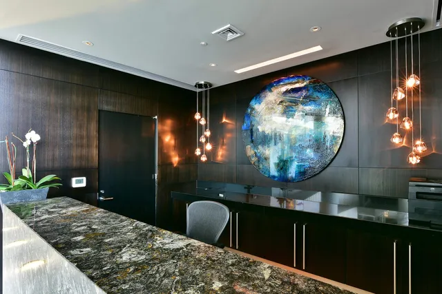 a living room with furniture and potted plant