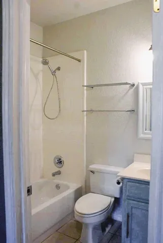 a bathroom with a toilet and a bathtub