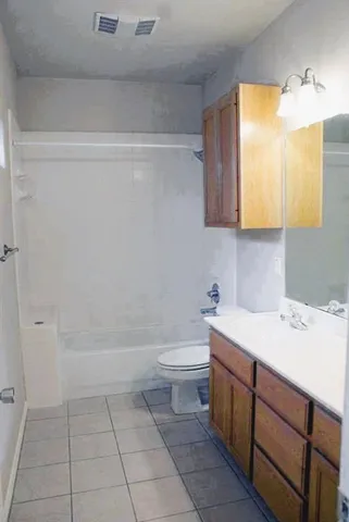 a bathroom with a sink a toilet and vanity