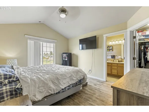 a bedroom with a bed and a television in it