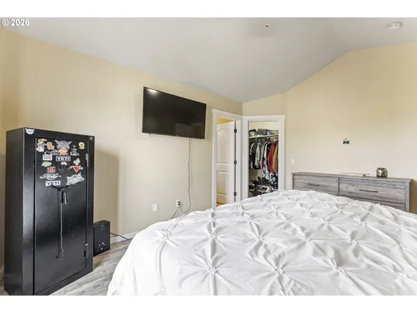 a large white bed in a white room