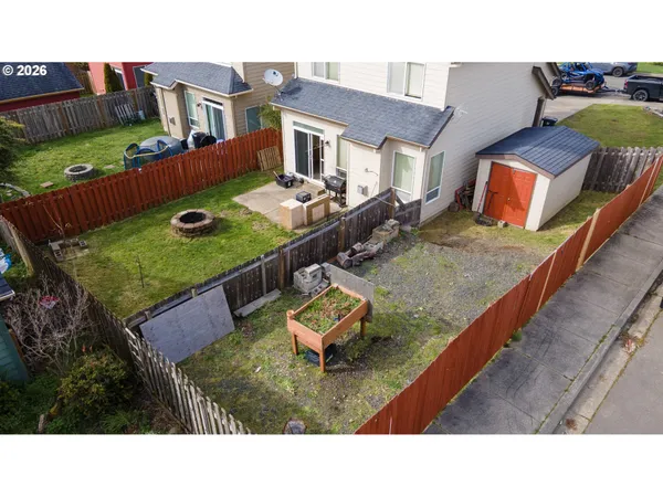 a view of a backyard with sitting area