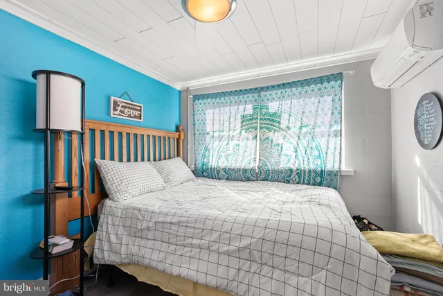 a living room with furniture a flat screen tv and rug