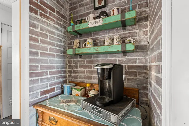 a kitchen with lots of counter top space and furniture