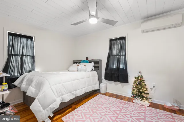 a bathroom with a shower and a sink