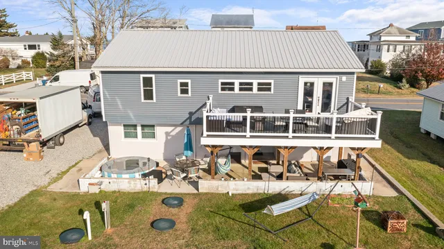 an aerial view of a house with swimming pool