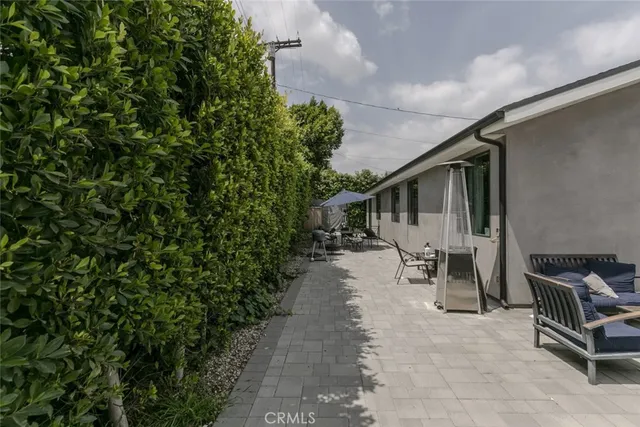 a view of a house with patio and sitting area