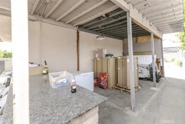 a view of a porch with wooden fence