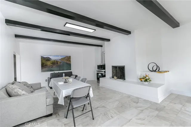 a large white kitchen with a sink and cabinets