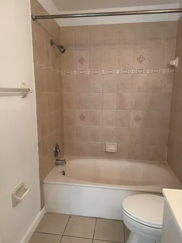 a bathroom with a bathtub and a toilet