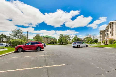 a view of street with parked cars