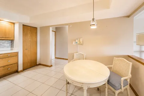 a spacious bathroom with a bathtub shower sink and mirror