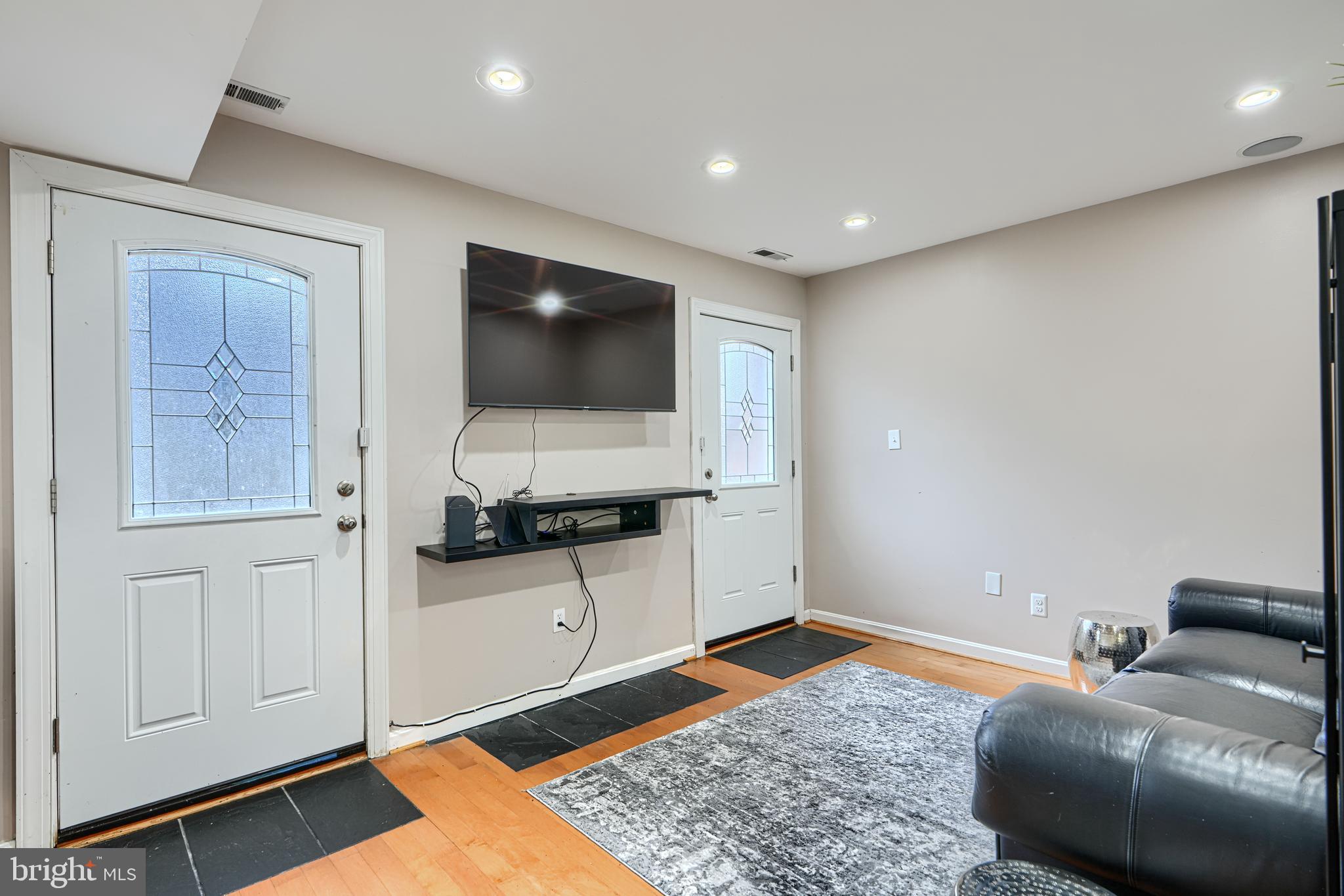 624 Jasper Street Baltimore, MD 21201 - Photo 13 of 24 a living room with furniture and a flat screen tv