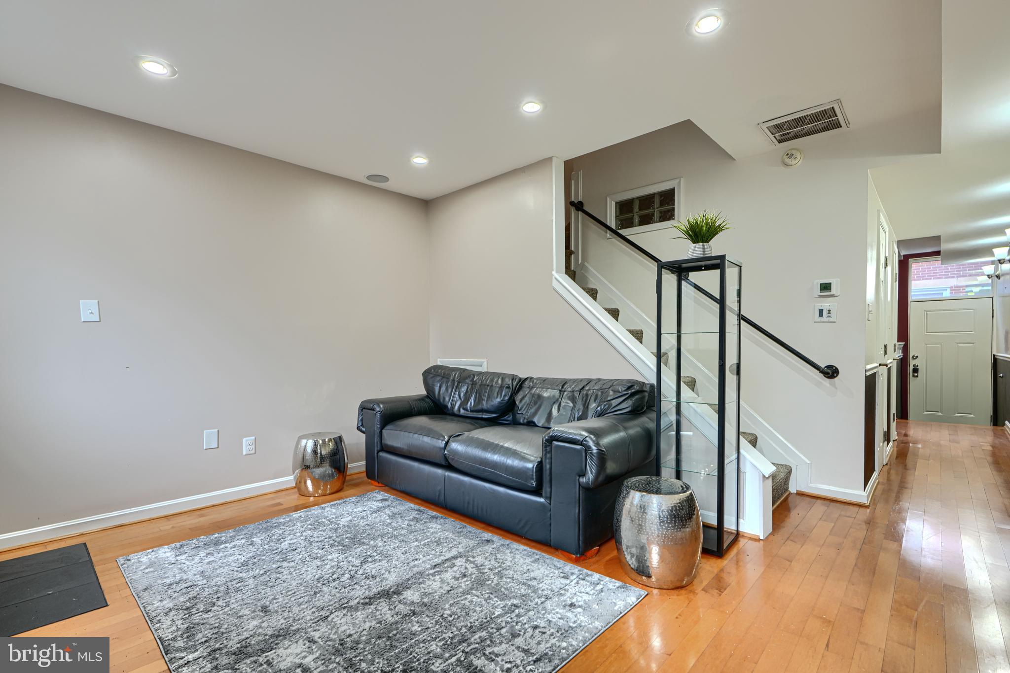 624 Jasper Street Baltimore, MD 21201 - Photo 14 of 24 a living room with furniture and stairs