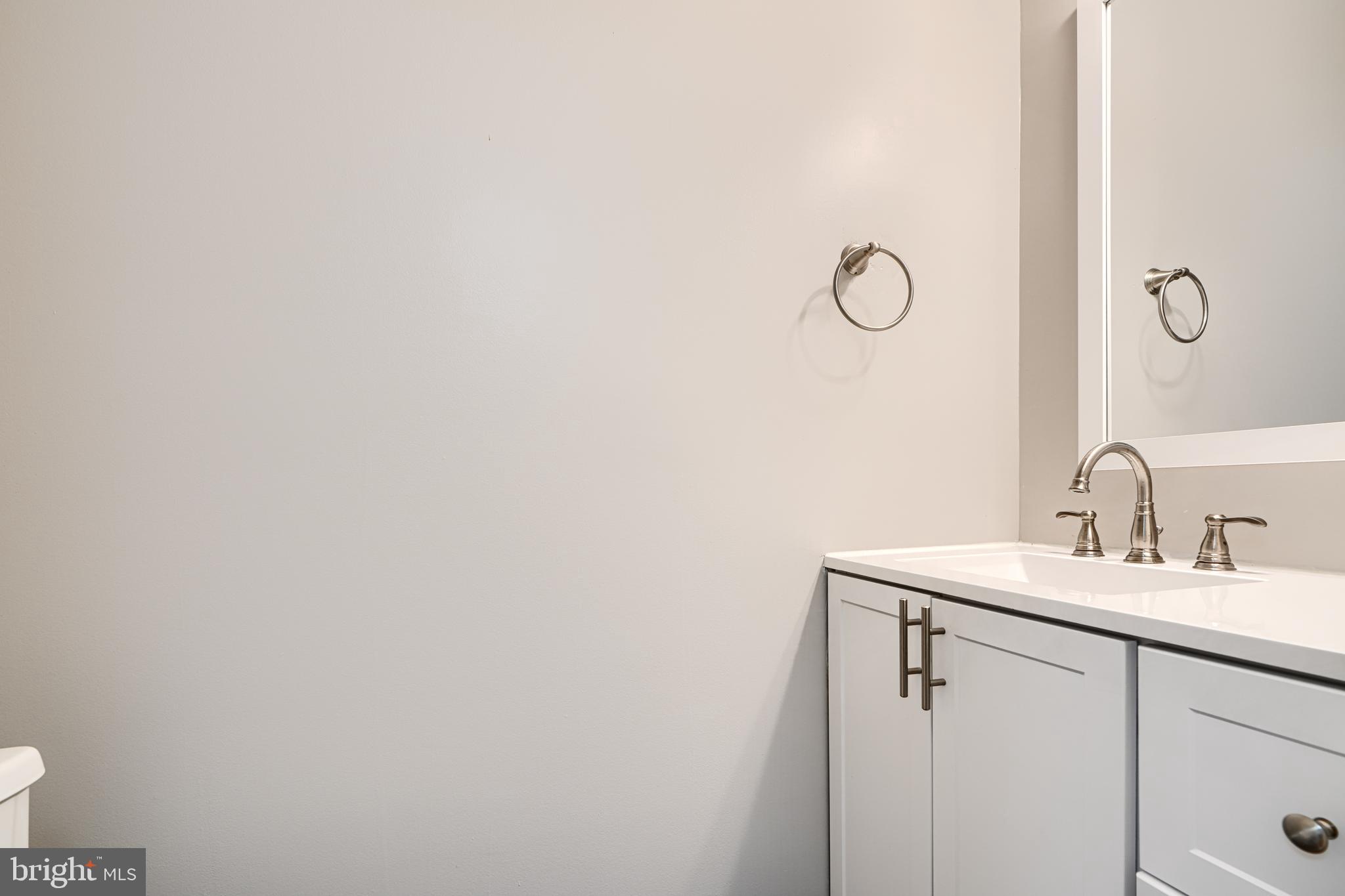 624 Jasper Street Baltimore, MD 21201 - Photo 16 of 24 a bathroom with a sink and mirror