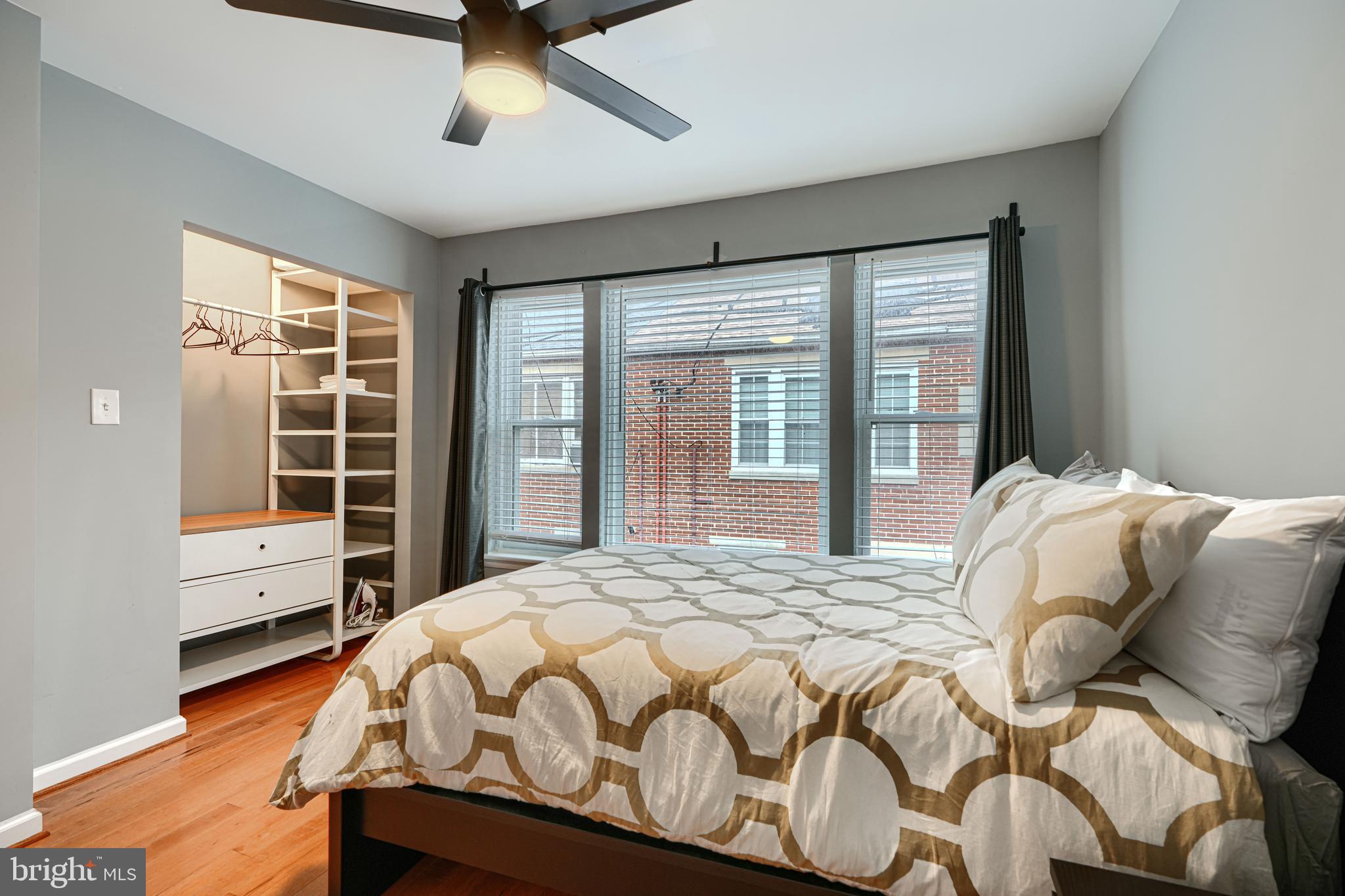 624 Jasper Street Baltimore, MD 21201 - Photo 17 of 24 a bed sitting in a bedroom next to a window