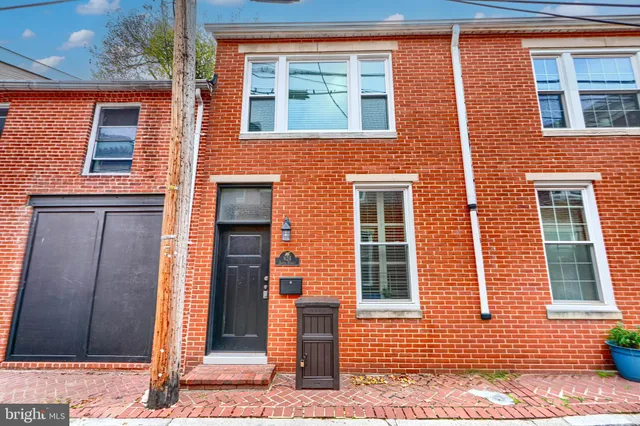 a view of a brick buildings with many windows