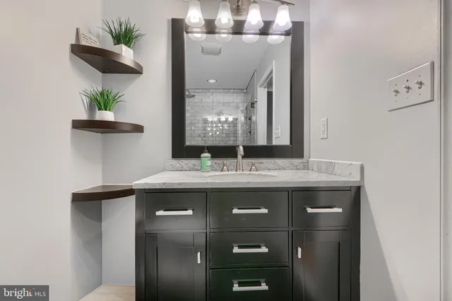 a bathroom with a sink and curtain