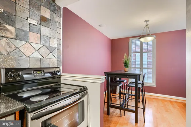 a room with lots of wooden furniture and view living room