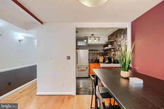 a kitchen with stainless steel appliances granite countertop a stove and a refrigerator