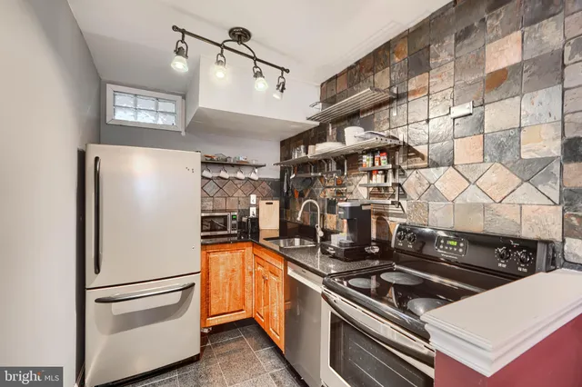 a close view of a stove top oven and cabinets