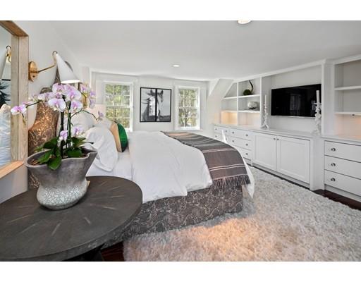 562 Main Street Hingham, MA 02043 - Photo 11 of 30 a bed room with a bed a television and a window