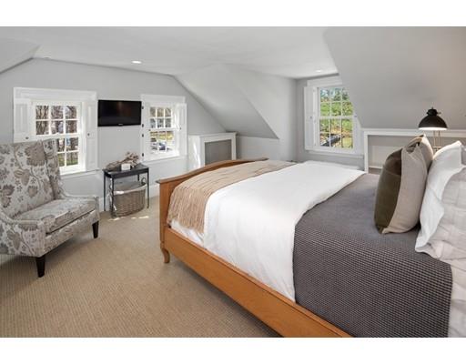 562 Main Street Hingham, MA 02043 - Photo 17 of 30 a bedroom with a bed and a flat screen tv