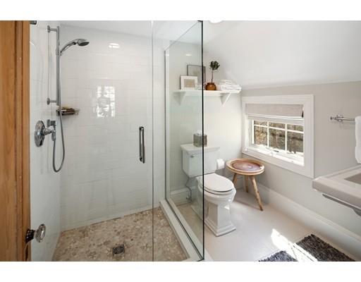 562 Main Street Hingham, MA 02043 - Photo 18 of 30 a bathroom with a toilet sink a shower and a window