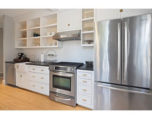 562 Main Street Hingham, MA 02043 - Photo 23 of 30 a kitchen with stainless steel appliances a stove a refrigerator and cabinets