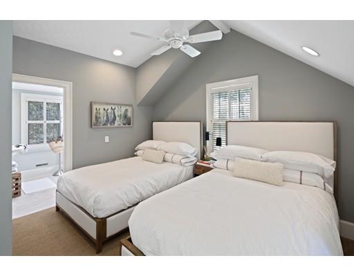 562 Main Street Hingham, MA 02043 - Photo 25 of 30 a bedroom with two beds and a chandelier