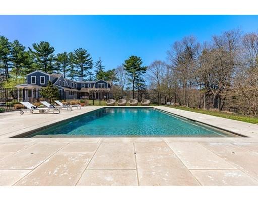 562 Main Street Hingham, MA 02043 - Photo 27 of 30 a view of a swimming pool with an outdoor space and seating area