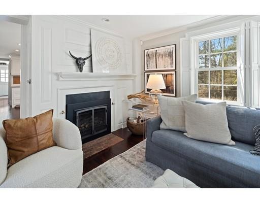 562 Main Street Hingham, MA 02043 - Photo 3 of 30 a living room with furniture large window and fireplace