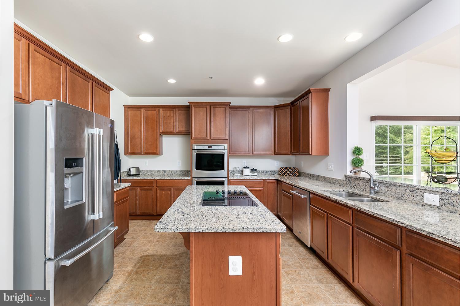 7036 Sand Cherry Way Clinton, MD 20735 - Photo 11 of 30 KITCHEN W/ ISLAND & BREAKFAST BAR