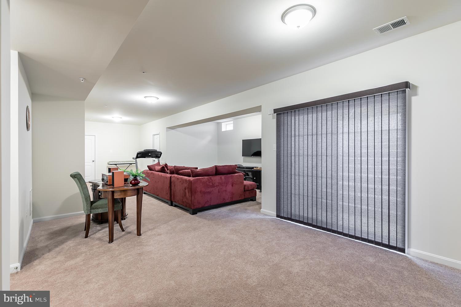 7036 Sand Cherry Way Clinton, MD 20735 - Photo 24 of 30 LOWER LEVEL RECREATION ROOM W/ REAR WALK UP STAIRS
