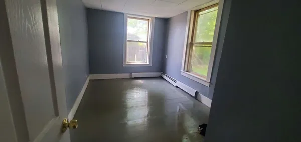 a view of empty room with floor to ceiling window