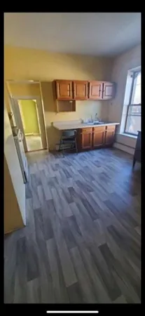a view of kitchen and wooden floor