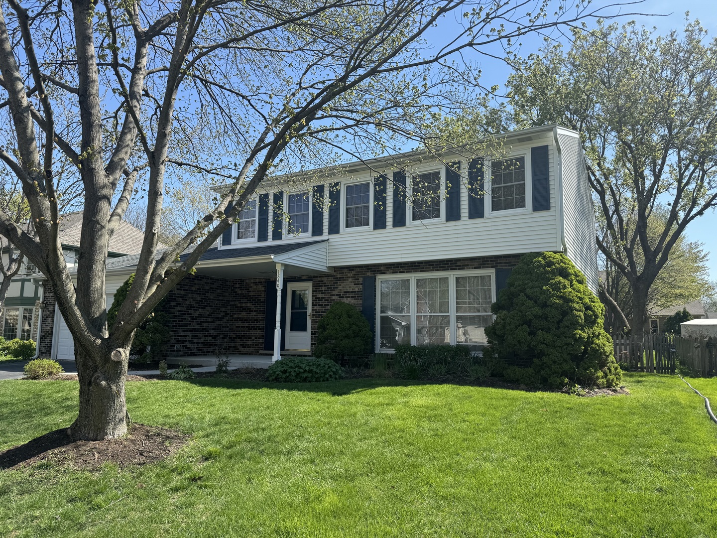 1840 Fairoak Road Naperville, IL 60565 - Photo 1 of 10 a view of a brick house with a large windows and a large tree