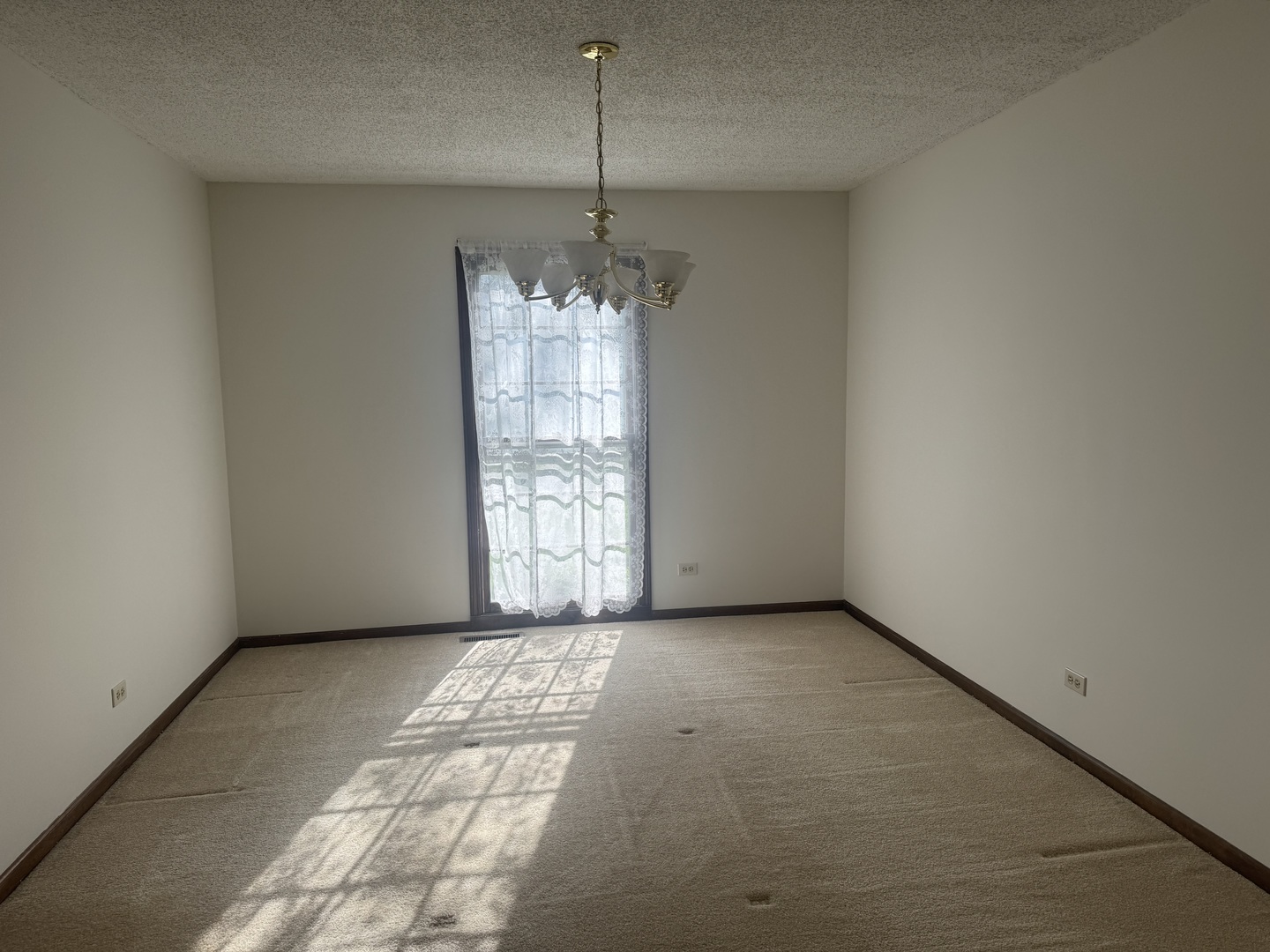 1840 Fairoak Road Naperville, IL 60565 - Photo 3 of 10 a view of an empty room with a window