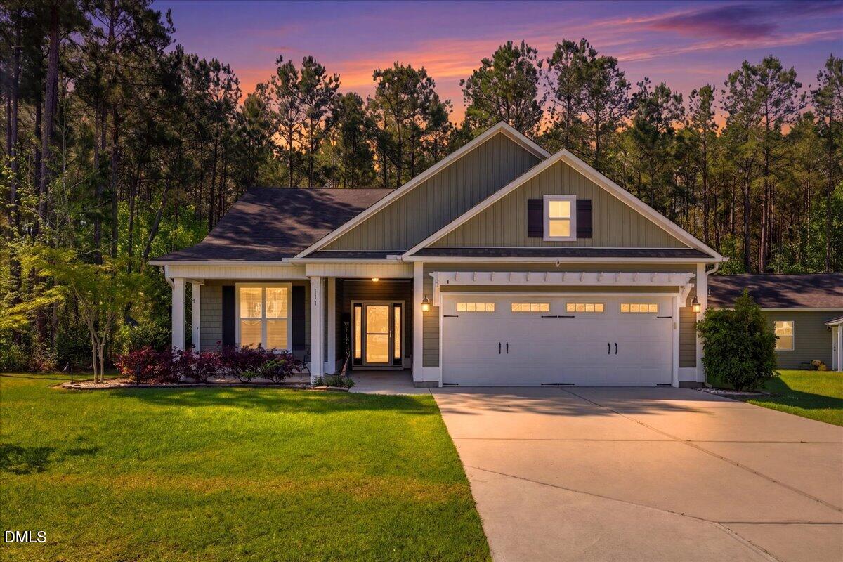 111 West Huckleberry Way Rocky Point, NC 28457 - Photo 1 of 72 a front view of a house with a yard