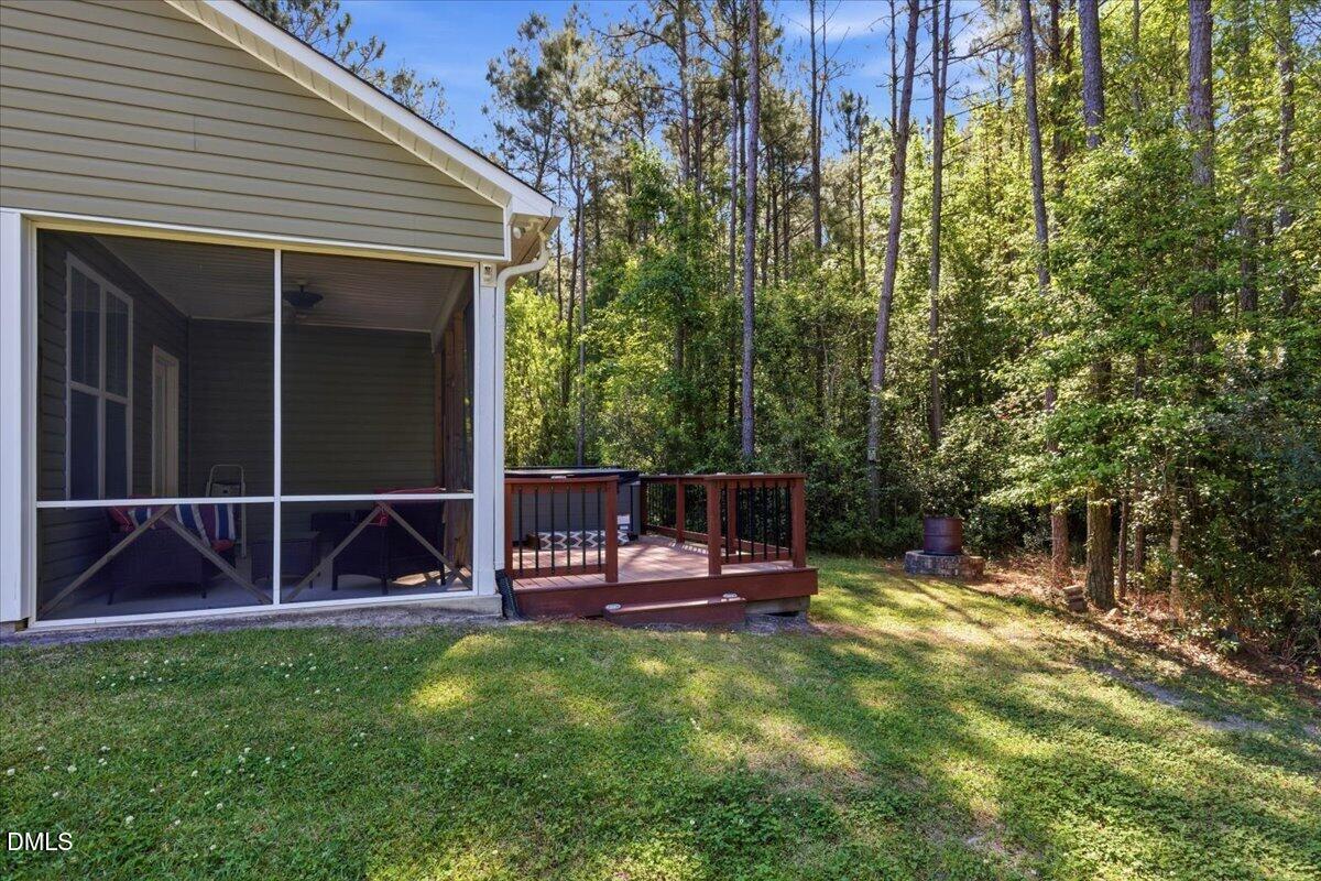 111 West Huckleberry Way Rocky Point, NC 28457 - Photo 13 of 72 a view of house with backyard and sitting area