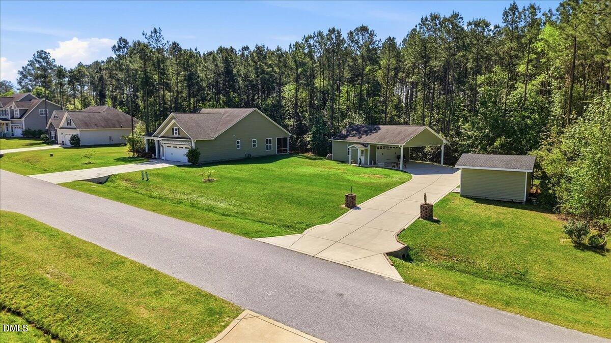 111 West Huckleberry Way Rocky Point, NC 28457 - Photo 18 of 72 a view of a house with garden and a trees