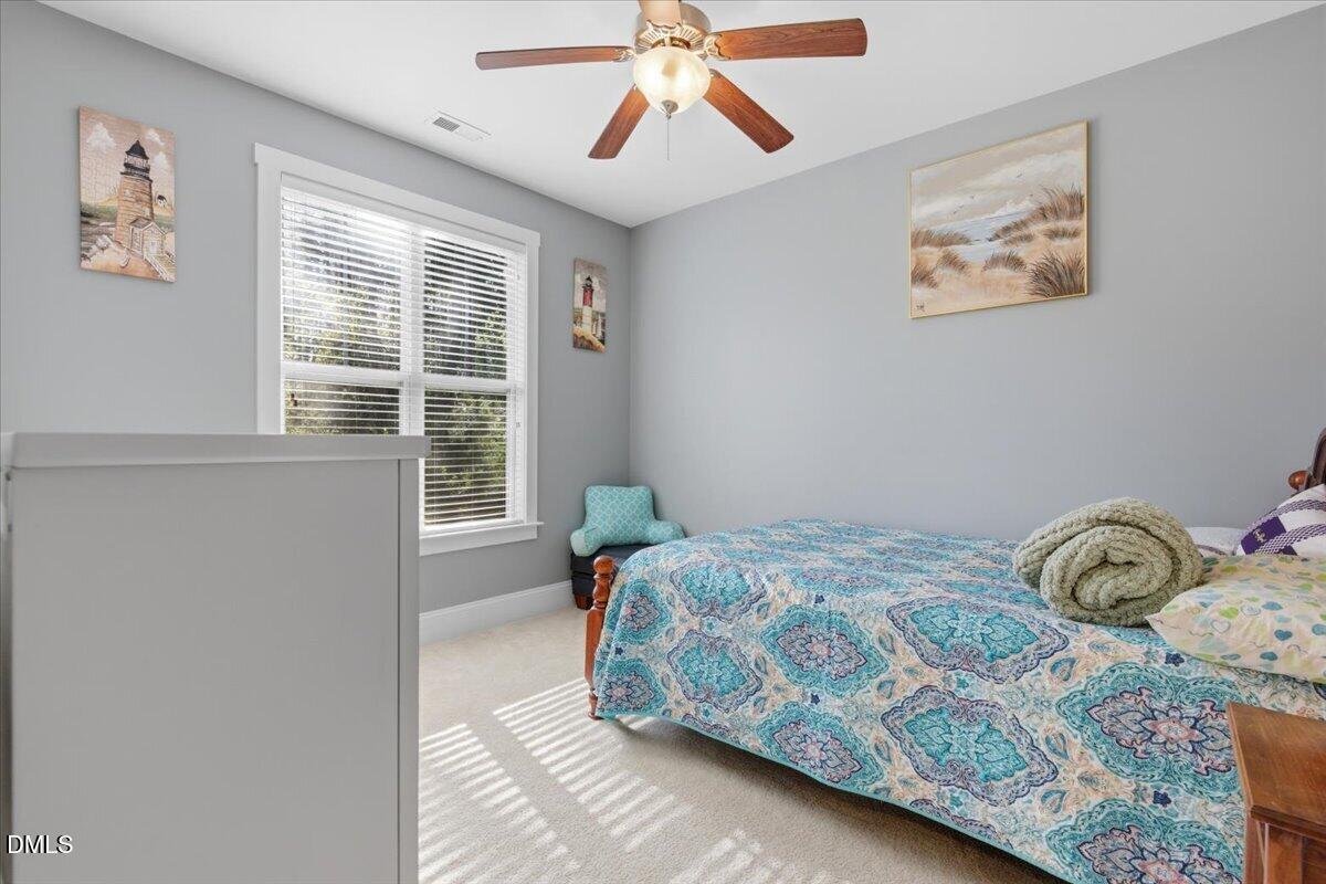 111 West Huckleberry Way Rocky Point, NC 28457 - Photo 46 of 72 a bedroom with a bed and a window
