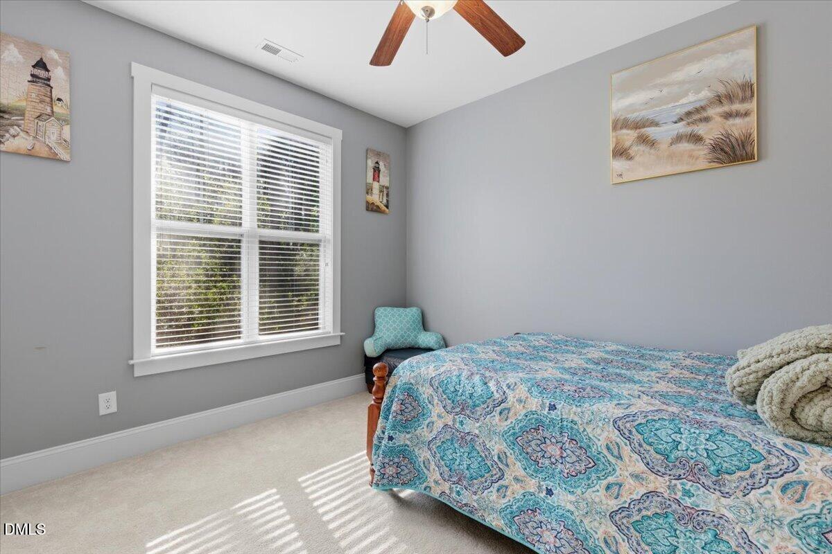 111 West Huckleberry Way Rocky Point, NC 28457 - Photo 47 of 72 a bedroom with a bed and a window