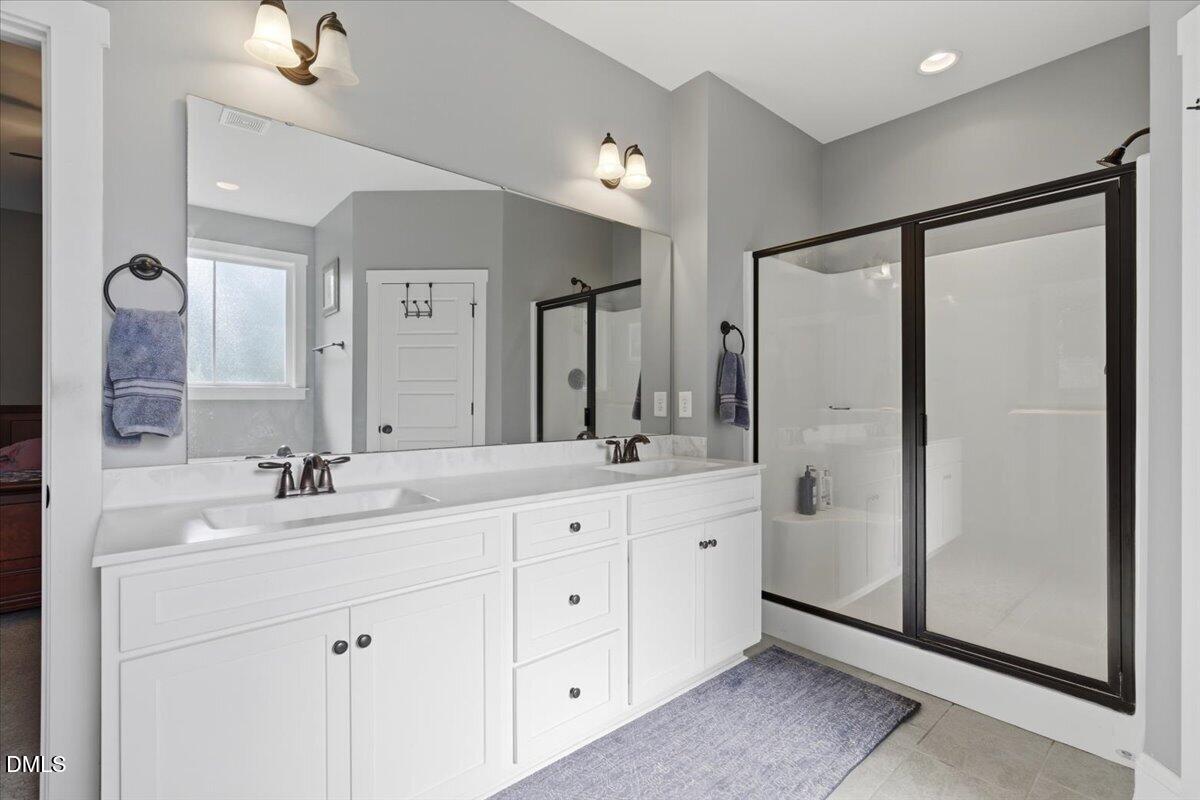 111 West Huckleberry Way Rocky Point, NC 28457 - Photo 51 of 72 a bathroom with a double vanity sink mirror and double