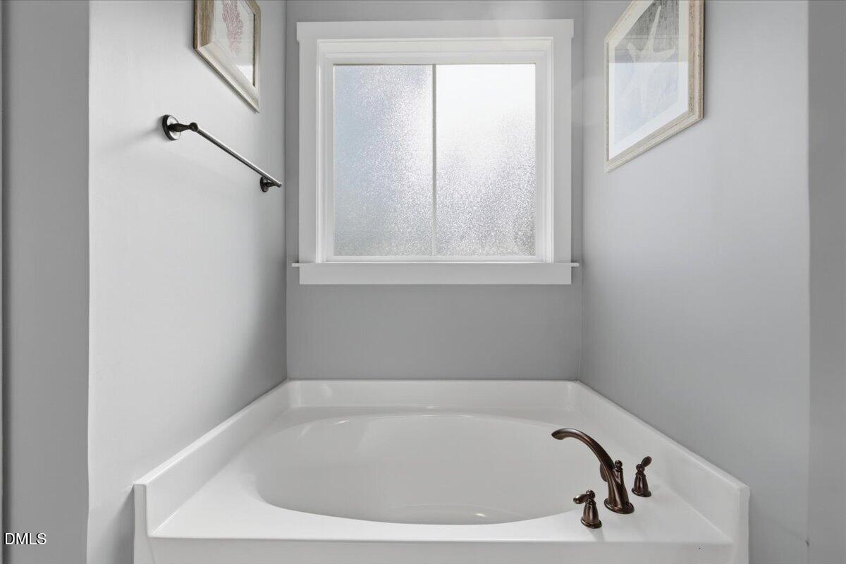 111 West Huckleberry Way Rocky Point, NC 28457 - Photo 52 of 72 a bathroom with a bathtub